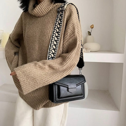 Timeless Leather Crossbody Bag with Decorative Strap