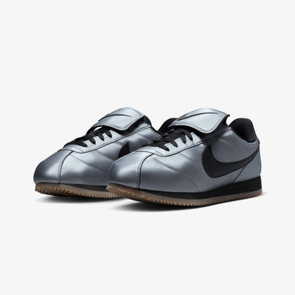 NIKE | CORTEZ { MTLC COOL GREY/BLACK-GUM DARK BROWN