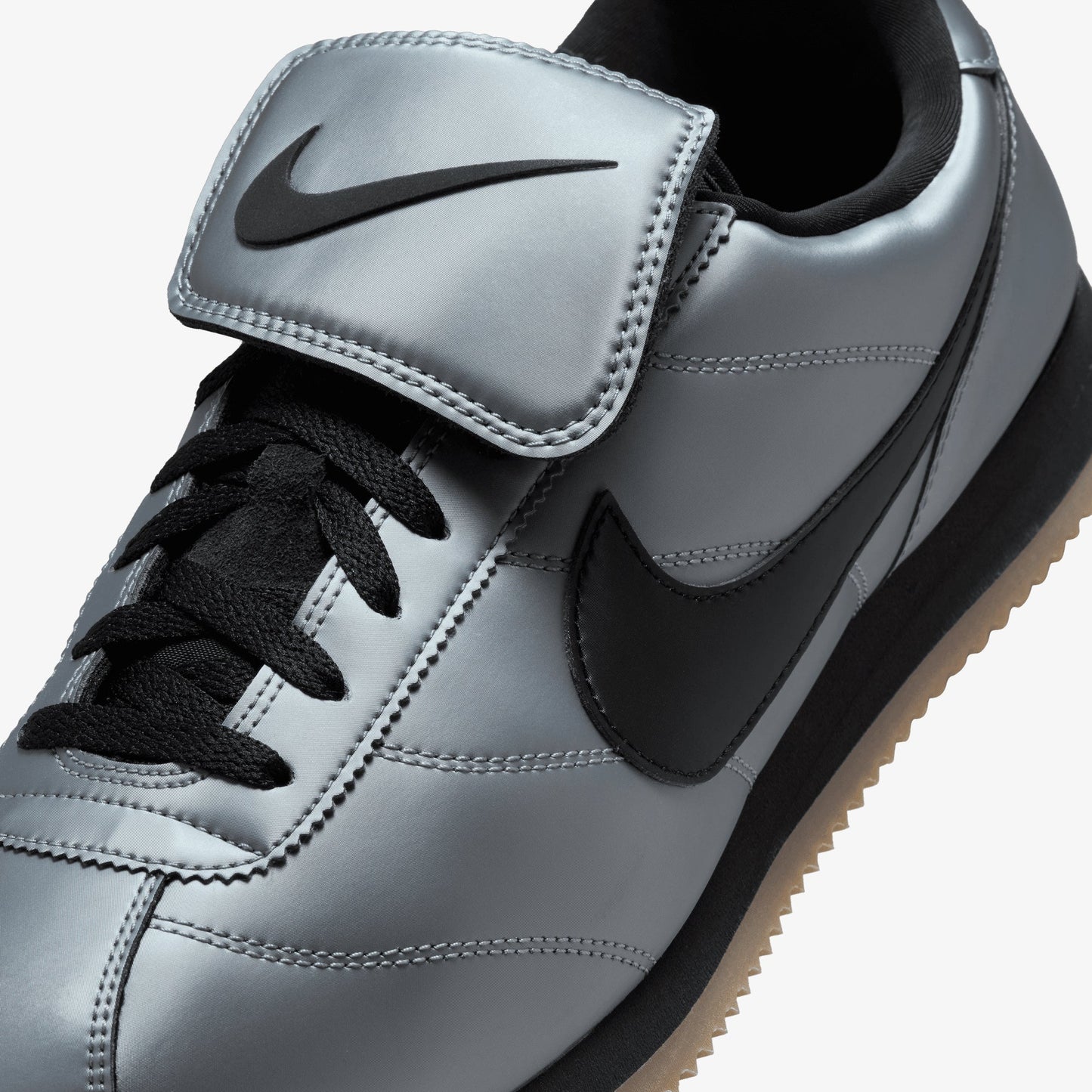 NIKE | CORTEZ { MTLC COOL GREY/BLACK-GUM DARK BROWN