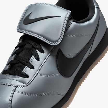 NIKE | CORTEZ { MTLC COOL GREY/BLACK-GUM DARK BROWN