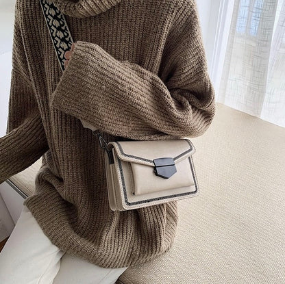 Timeless Leather Crossbody Bag with Decorative Strap